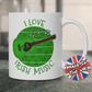 A mug featuring a green acoustic guitar, shamrocks and "I Love Irish Music"