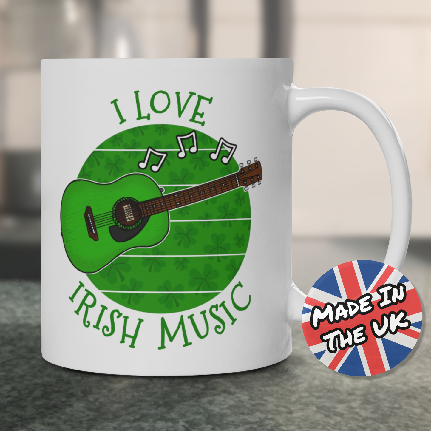 A mug featuring a green acoustic guitar, shamrocks and "I Love Irish Music"