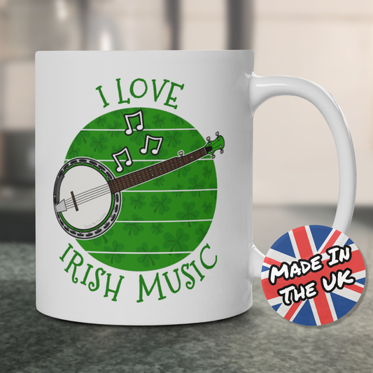A mug featuring a banjo, shamrocks and "I Love Irish Music"